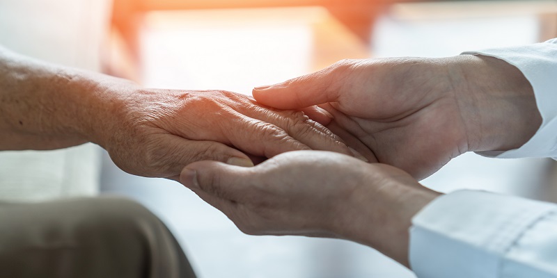 Two people holding hands