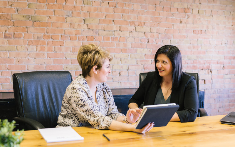 Two women executives at a table