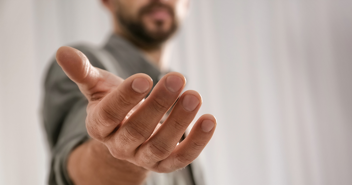 Man with outstretched hand