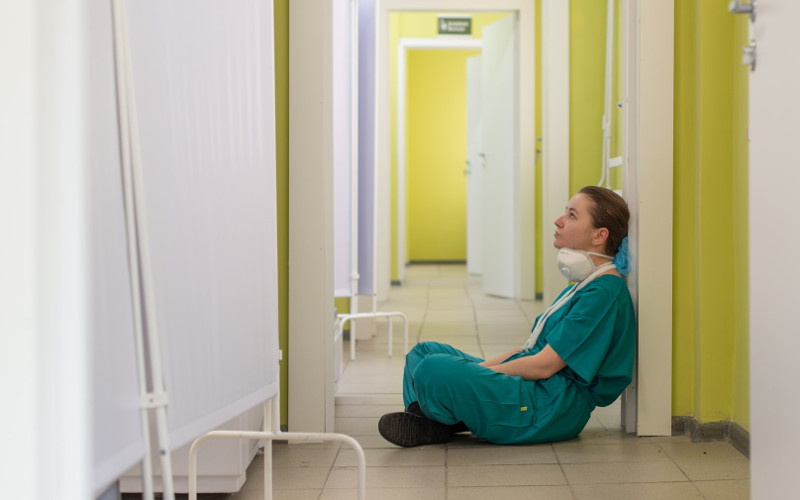 tired nurse with mask